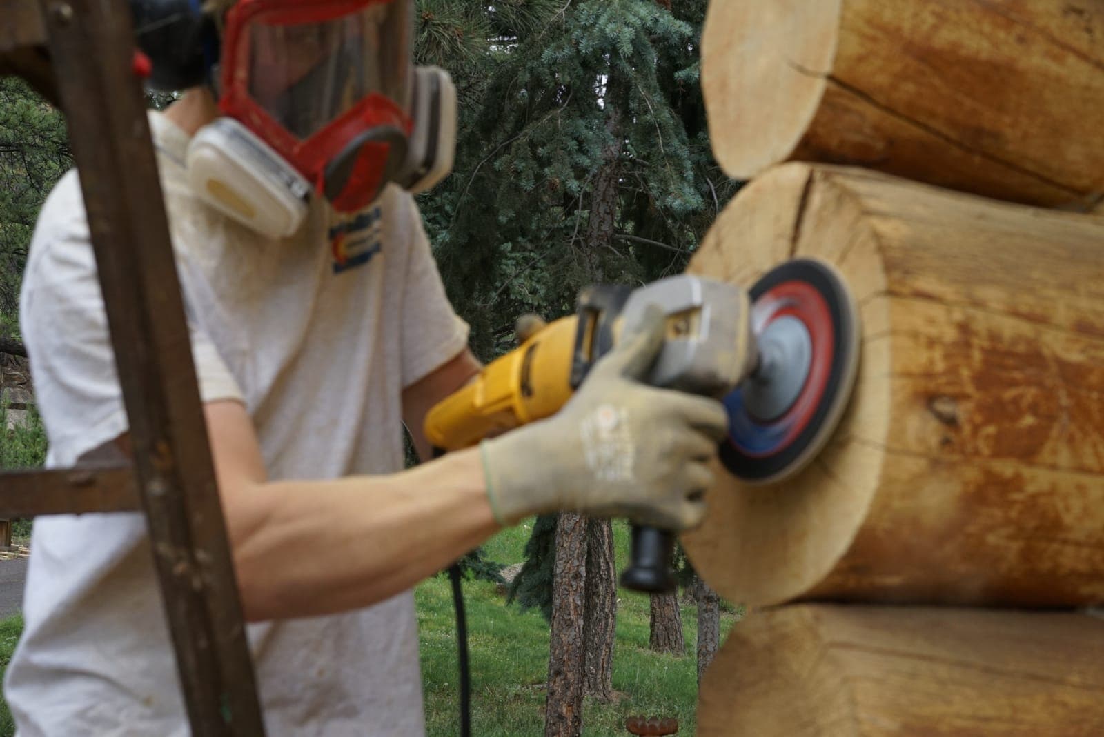 Thomas Elliott's team performing expert log home restoration and sanding in Colorado