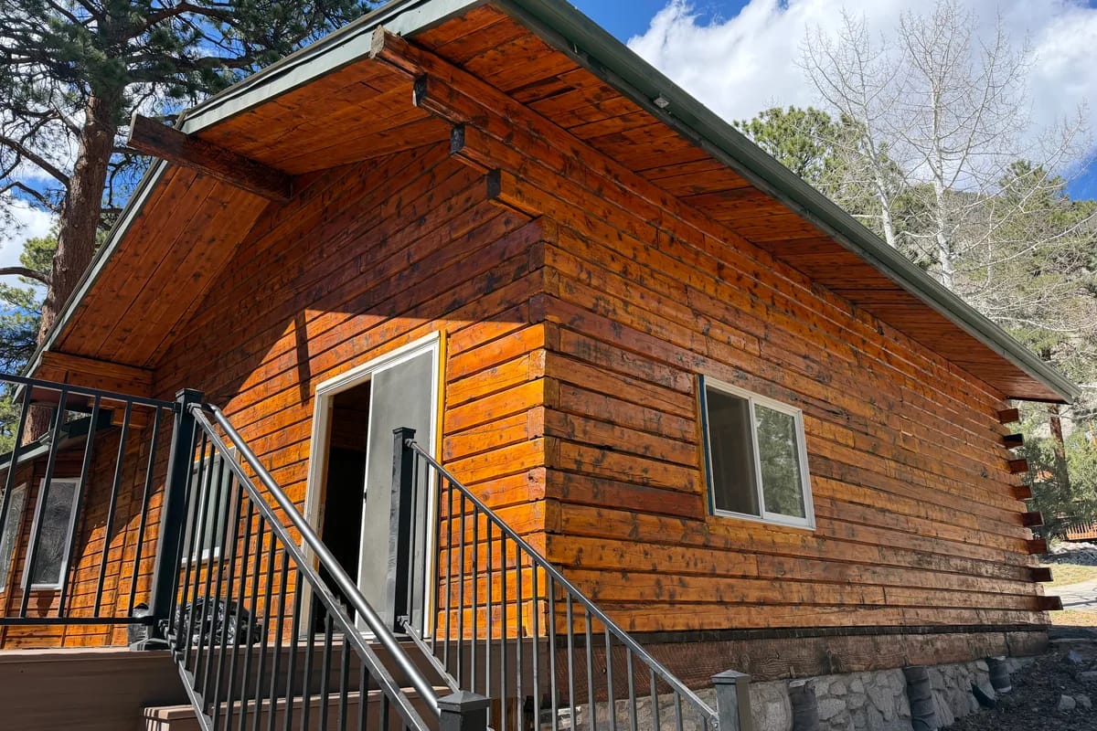 Professional log home staining service with premium products