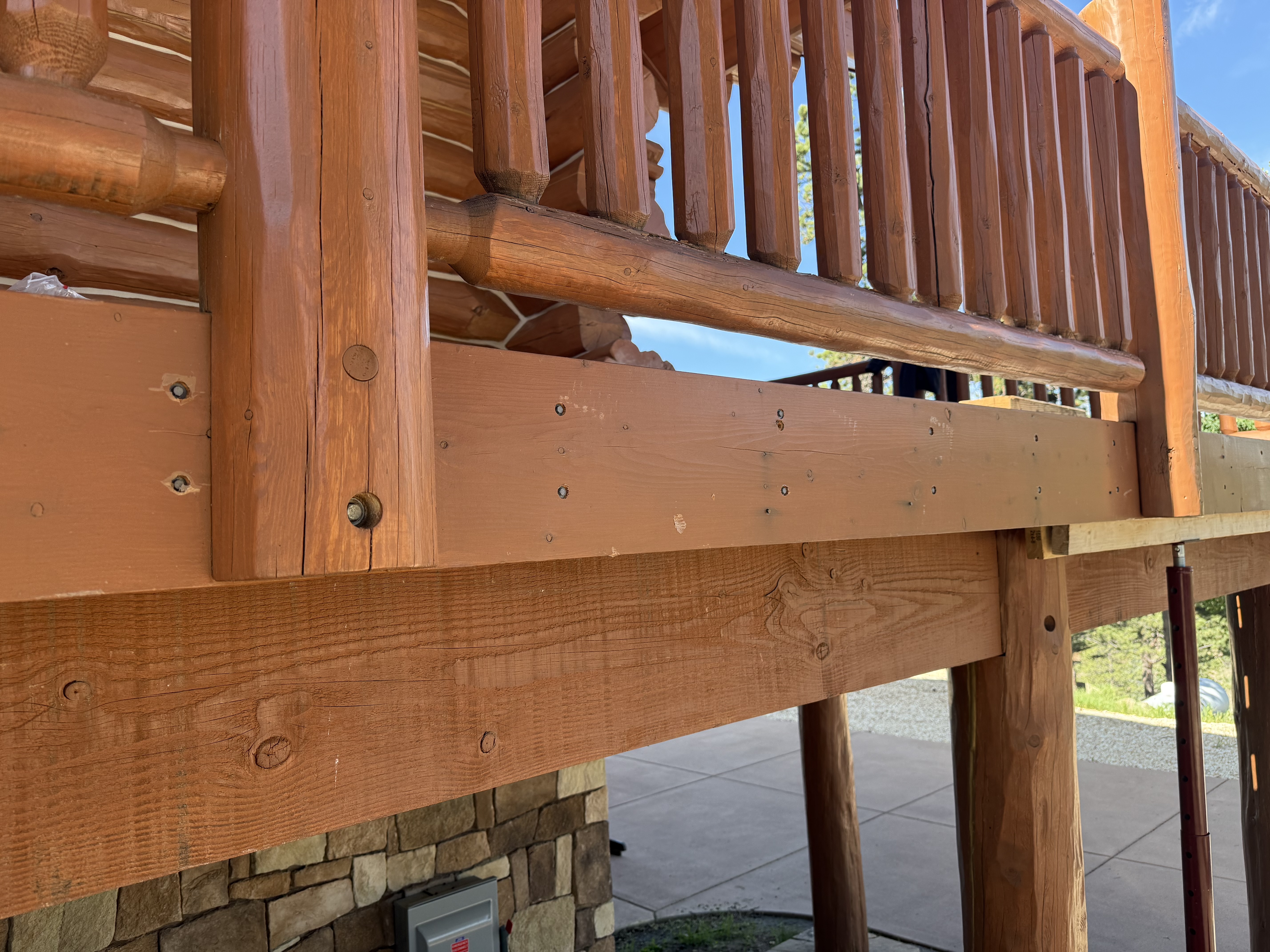 Deck shoring system supporting log beams during structural repair